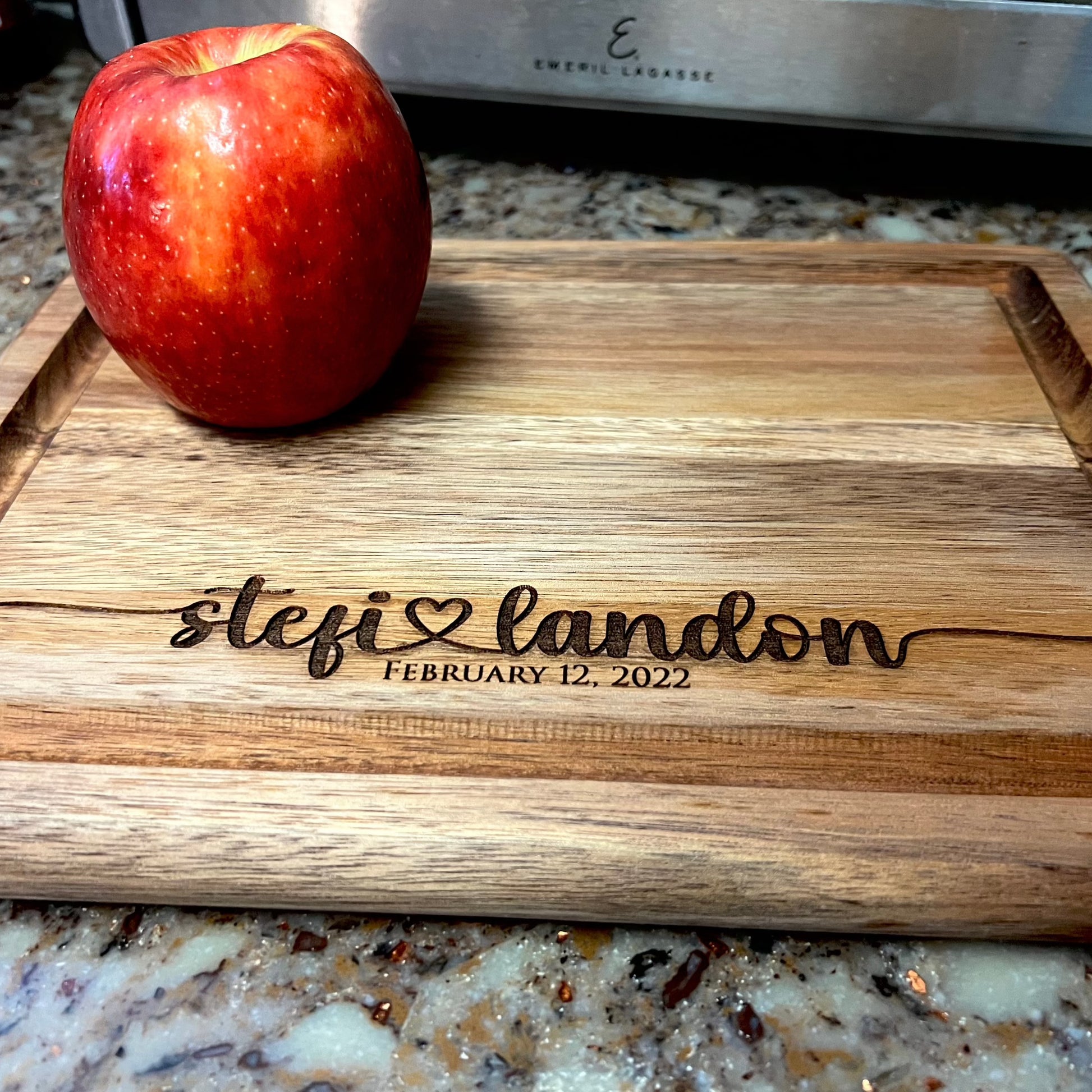 Cutting board with names, heart, and wedding date